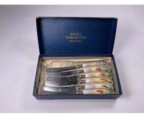 A set of six Royal Worcester bread knives with hallmarked silver collars and ceramic painted with sailboats by Raymond Rushto