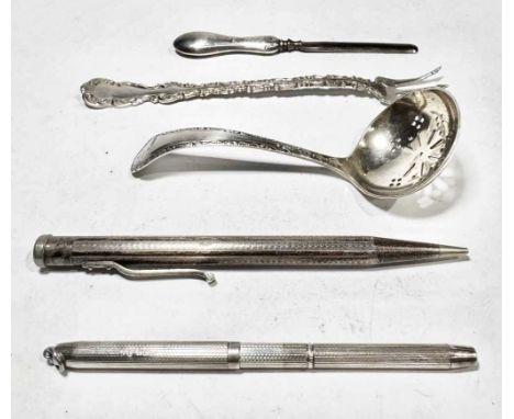 A George V silver sifter ladle, W S Savage &amp; Co., Sheffield 1912, length 10cm, together with two silver-coloured metal pe