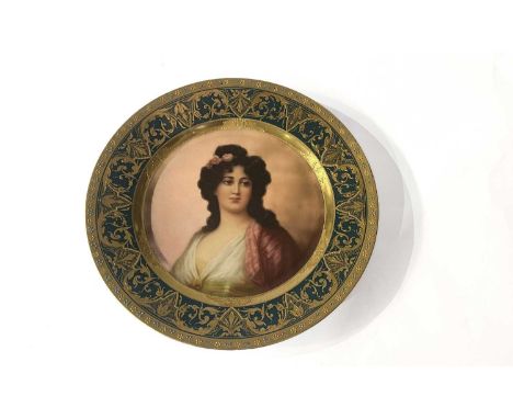 A Vienna porcelain cabinet plate, late 19th century, circular form, centrally painted polychrome enamel portrait of a beautif