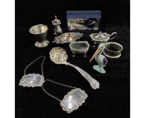 A collection of hallmarked silver and plate including spirit labels, silver napkin ring, boxed scent bottle etc. together wit