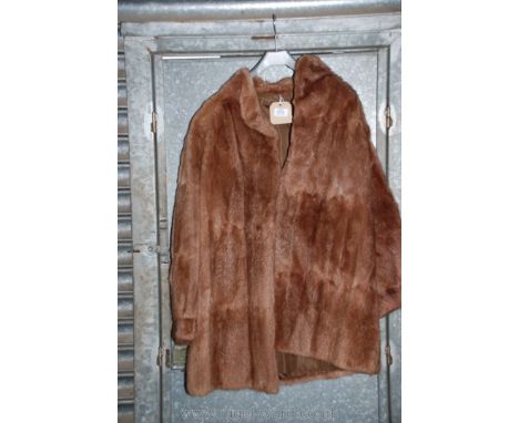 A light brown fur coat.