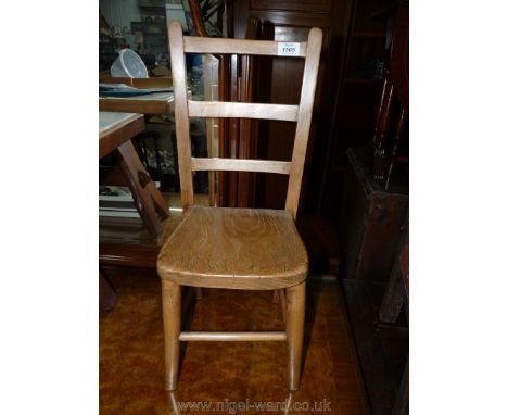 A very appealing child's small Chair of ladderback design with solid Elm seat, 23 1/2'' high x 9 1/2'' wide x 10'' deep