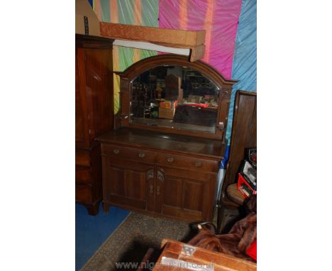 A 1920/30's Oak mirrorback Sideboard having opposing doors to the base, one revealing an interior with an unusual narrow thre