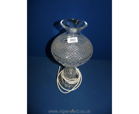 A cut glass table lamp and shade