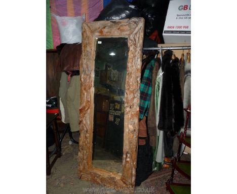 A rustic driftwood framed rectangular Mirror, 71" x 27 1/2" overall. **