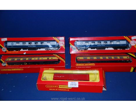 Five boxed Hornby 00 gauge carriages including Golden Arrow and track cleaning car.