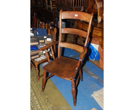 A mixed woods ladderback kitchen Carver Chair having turned legs and arm supports and solid seat