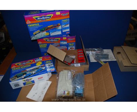Three boxed Micro Machine; train station, trestle and engine house.