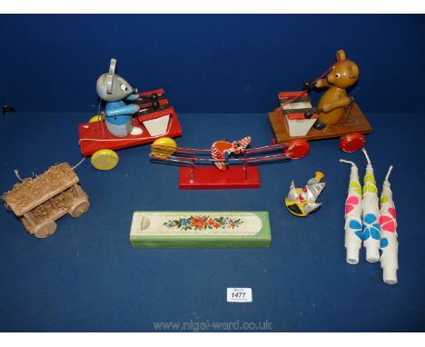 A box of vintage toys including two mice pull along on string.