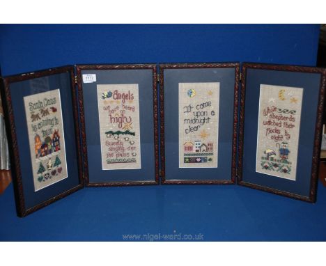 A four panel tapestry, folding Christmas icons.