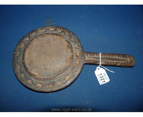 A very early possibly medieval carved wood hand Mirror frame having carved decoration to the back depicting stylised foliage,