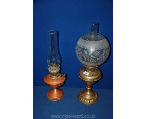 A brass oil Lamp complete with a globe shade plus a copper oil Lamp.