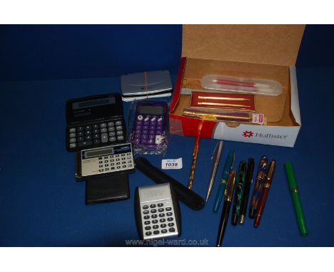 A quantity of Pens and pencils including Parker, Conway Stewart, Platignum and Sheaffer together with various calculators inc