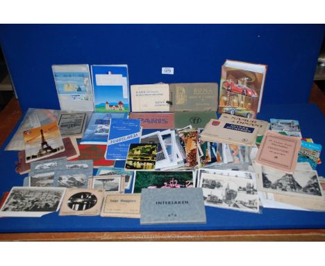 A tub of vintage travel booklets including Belgium, Germany and France.