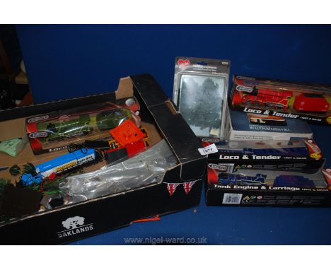 A box of trains and tracks including Teamsters locomotive and tender, tank engine and carriage, trees, transformer etc.