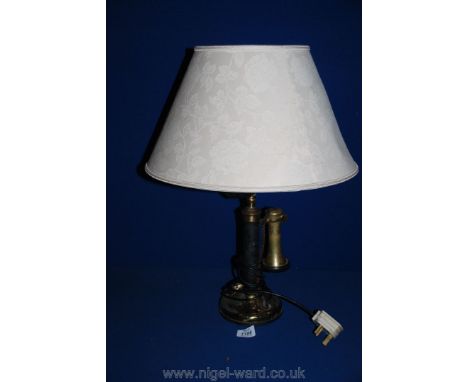 An old telephone table lamp.