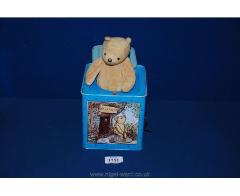 A vintage tin toy pop-up of Winnie the Pooh, working.
