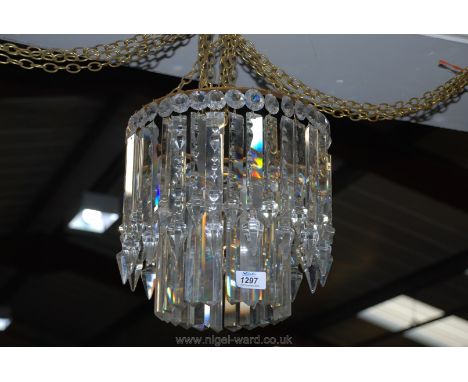 A fine old crystal chandelier having a two stage circle of 36 prisms to the exterior with 22 plain triangular glass prisms to