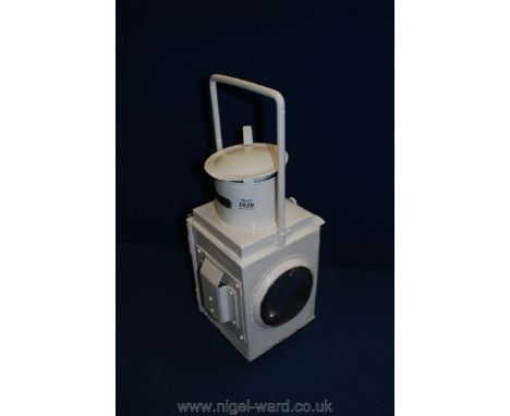 A white BR(W) Railway lamp.