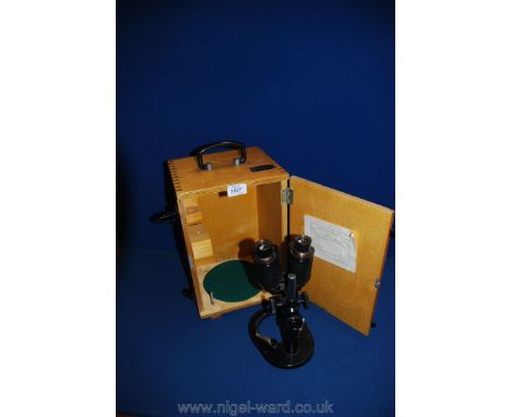 A boxed 1950's Microscope.