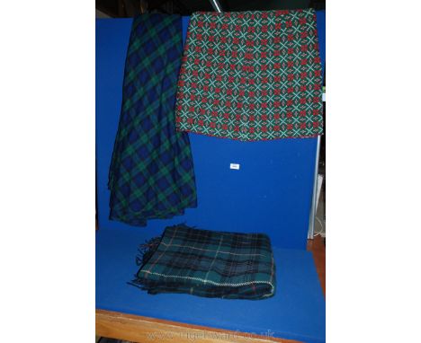 A travel Rug in 'Hunting Stewart' tartan, ladies maxi wraparound skirt in tartan and short skirt length of woven fabric in gr