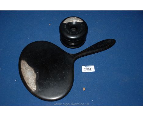 An ebony hand mirror and an Inkwell with silver ornamentation.