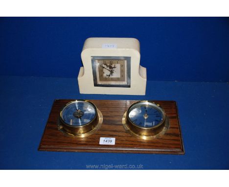 A wooden Smiths clock and a clock and barometer.