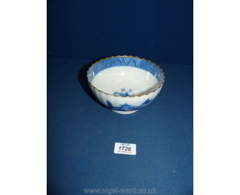 A 18th c. porcelain Bowl in 'Willow' pattern, faint blue ring to base and small blue line, some chips.