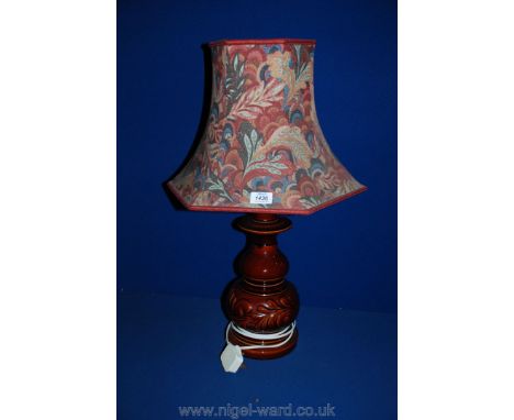 A brown china Lamp with multi-colour shade.