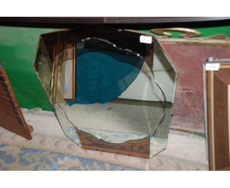 A large bevel edged wall Mirror having scalloped edge centre.