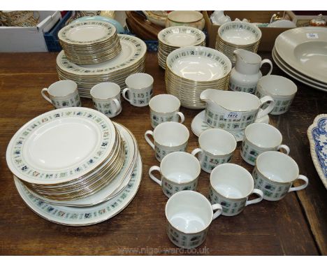 A twelve place Dinner service by Royal Doulton in 'tapestry' pattern including; twelve of each dinner plates, tea plates, sid