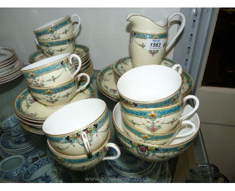 A Royal Worcester 'Daytona' tea service, consisting of nine cups, eleven saucers, twelve tea plates, two bread and butter pla