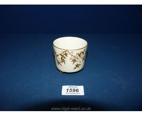 A blush ivory Royal Worcester aesthetic movement circular Jar with hand gilded leaves, branches and berries standing on shape