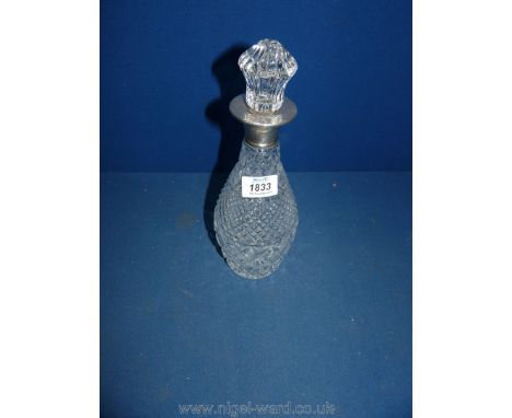 A glass Decanter with silver rim, London 1962.