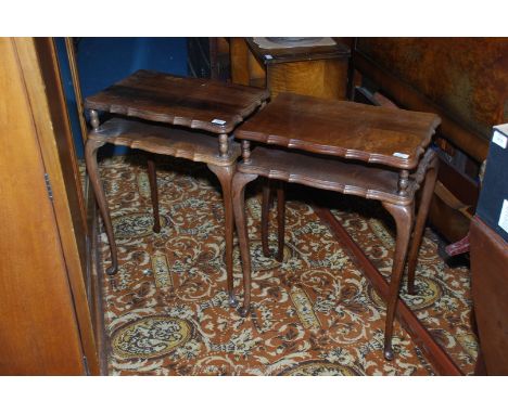 A pair of satinwood Bedside Tables having shaped edges to the rectangular tops, a shelf/recess below and standing on slender 