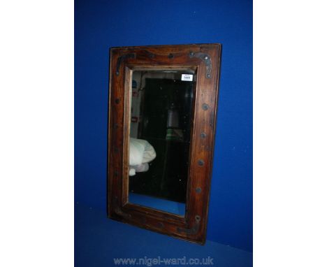 A rectangular Mirror with wooden surround