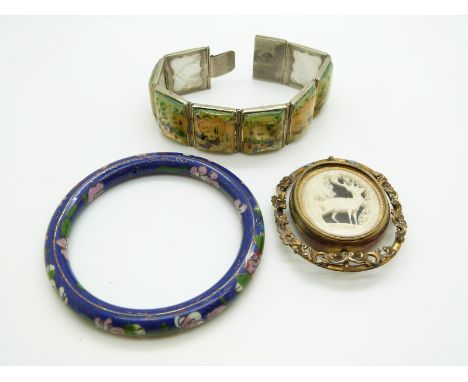 A white metal bracelet set with painted mother of pearl panels, a cloisonne bangle and a Victorian pinchbeck brooch