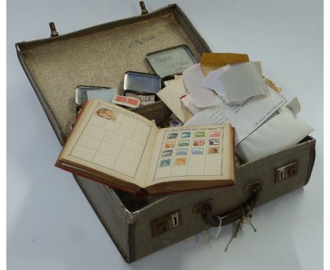 A suitcase of loose GB, Commonwealth and foreign stamps and a Lincoln stamp album&nbsp;