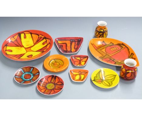 Eleven pieces of Poole Delphis pattern dishes and vases including a charger by Carole Cutler, largest diameter 27cm&nbsp;