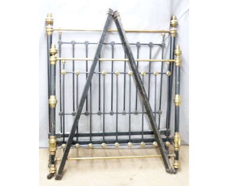 A 19th/20thC brass and iron double bed raised on ceramic castors, W140cm&nbsp;
