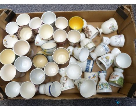 Approximately&nbsp;45 novelty large size egg cups, probably for goose eggs including Royal Doulton, Astbury, Masons etc