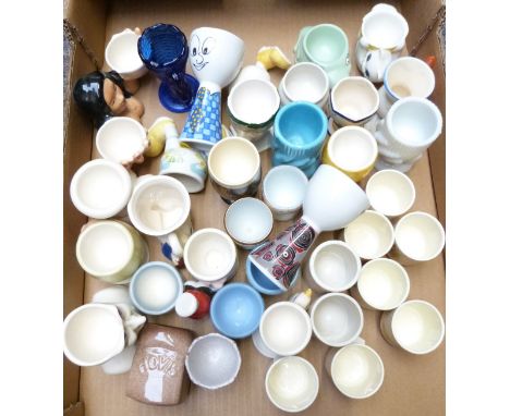 Approximately 40 novelty egg cups including Carltonware, Royal Doulton Bunnykins, retro Scandinavian, glass, Guinness and Goe