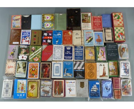 Approximately 50 packs of vintage playing cards, including LNER, De La Rue etc and a lacquer case