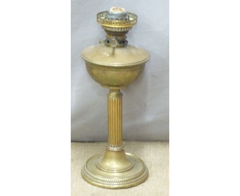 A brass oil lamp, H49cm