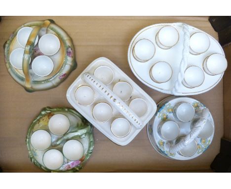 Five egg cruets including Burleigh and porcelain examples probably Spode / Minton, tallest 12cm