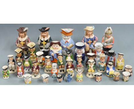 A large collection of mainly small and miniature Toby character jugs including Wood, Goebel etc