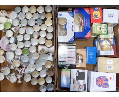 Approximately 65 novelty egg cups including many boxed examples including Lurpak, Harry James, Masons, Aynsley, Crown Staffor