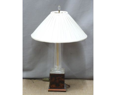 A cut glass table lamp raised on a&nbsp;chinoiserie decorated plinth and another alabaster lamp with swan handles, tallest 73