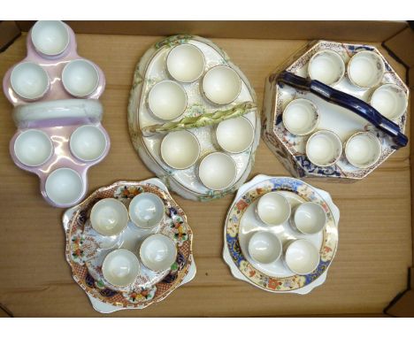 Five ceramic egg cruets including Imari and relief moulded examples, tallest 13cm