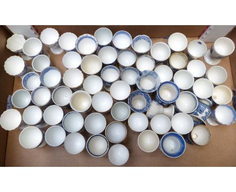 Approximately 65 egg cups, most blue and white transfer printed including Victoriana, George Jones, Abbey Pottery, Willow pat